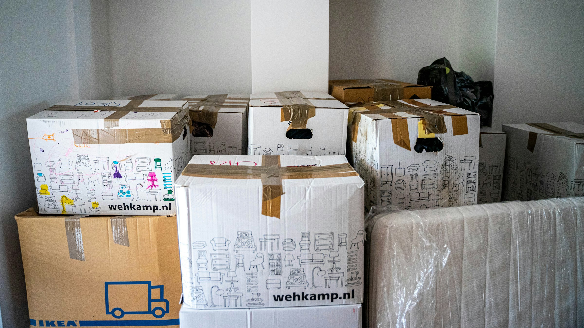 Moving boxes stacked in a room