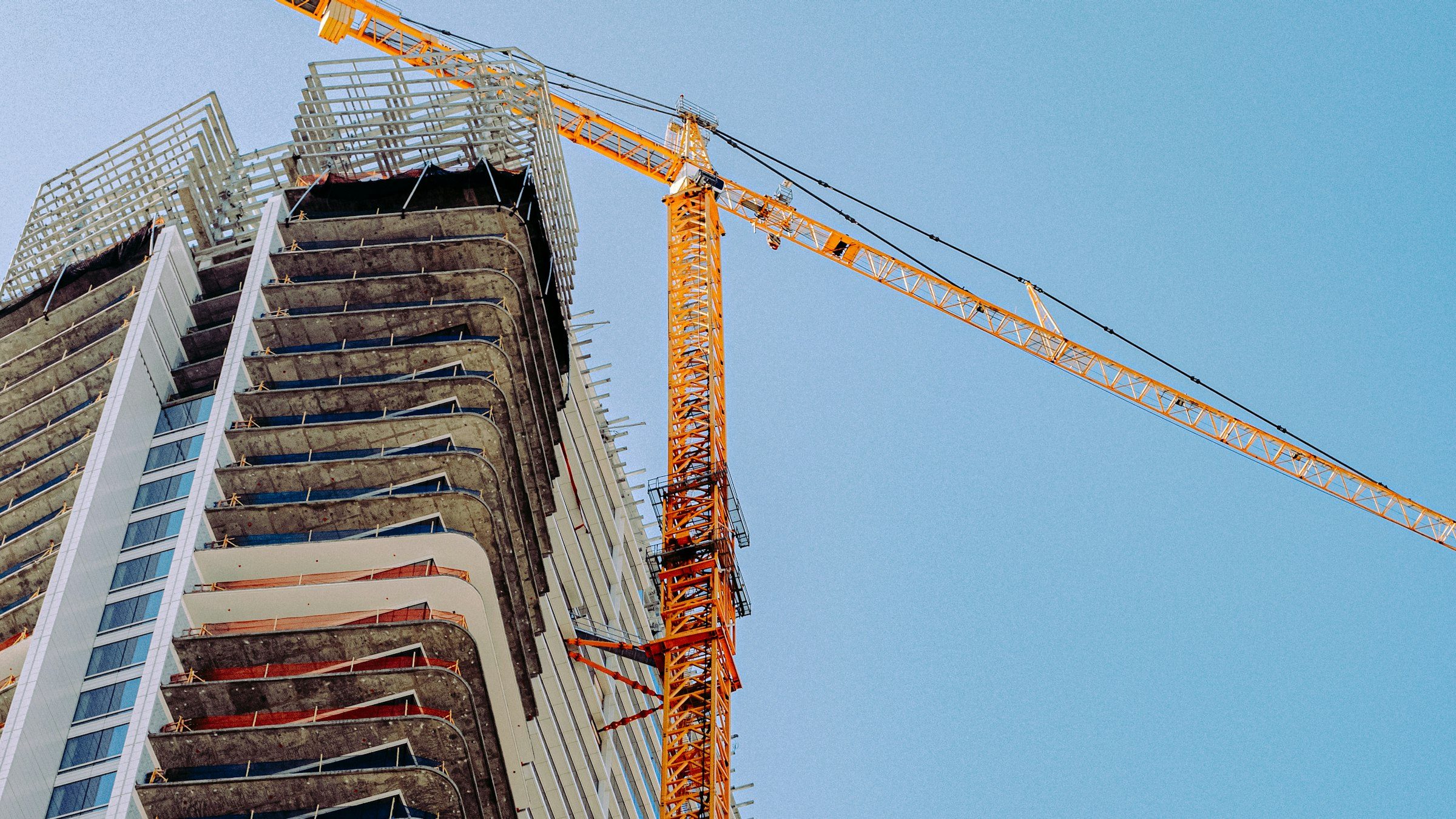 Tower crane beside a condo tower under construction