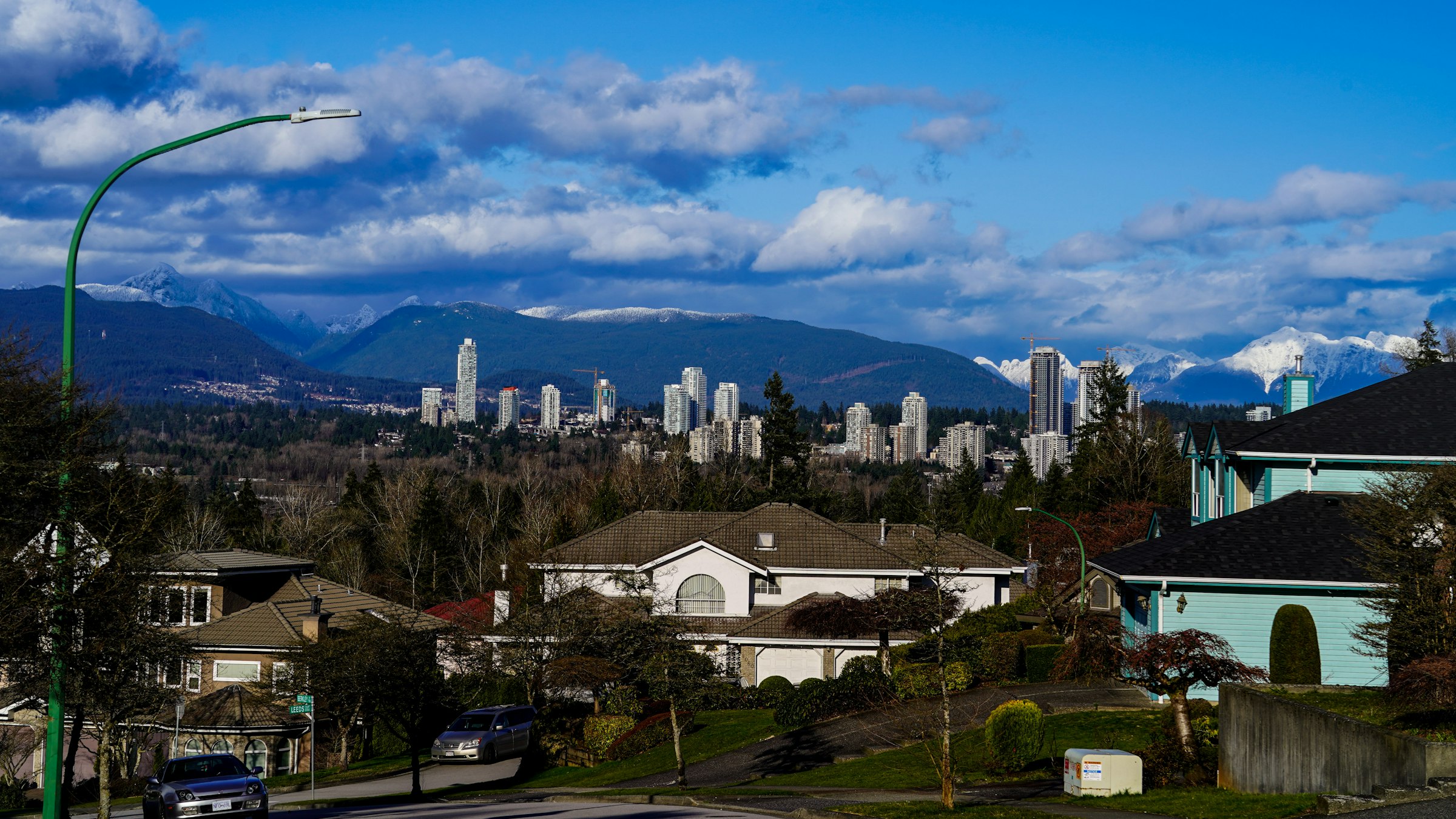 Houses with the city skyline and North Shore mountains behind